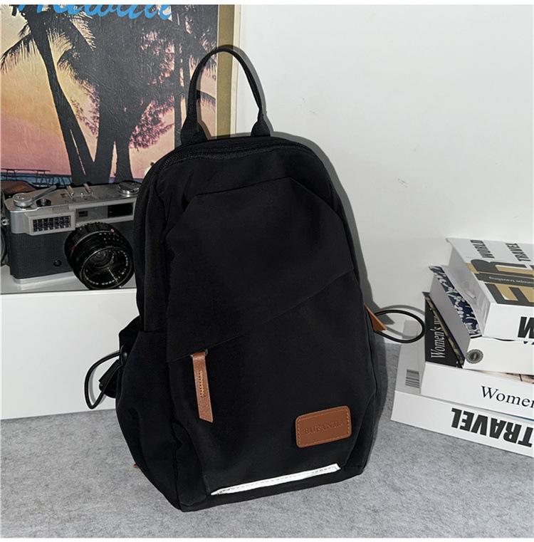 

Spring and summer new student large-capacity waterproof nylon fabric backpack contrasting color couple breast bag backpack чорний
