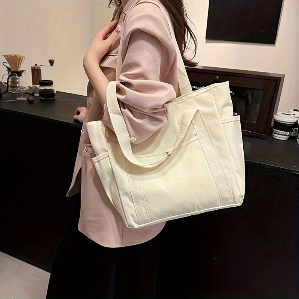 Przestronna torba płócienna: Idealna do dojazdów do pracy lub na uczelnię – zapięcie na suwak, bez podszewki, bez ozdób