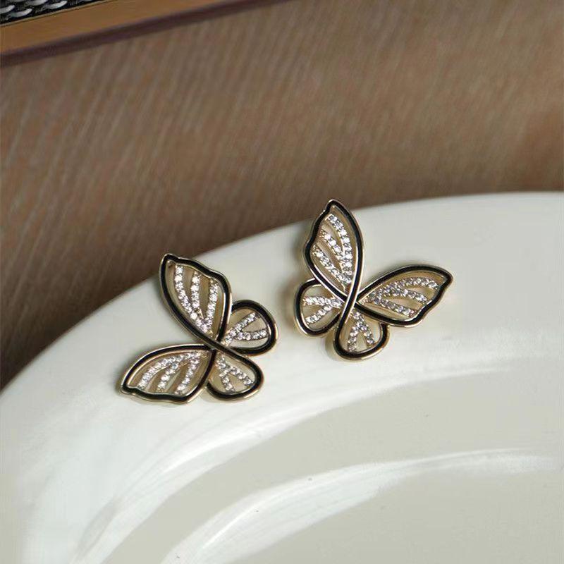 

Butterfly stud earrings female niche design high-end French versatile full diamond stud earrings