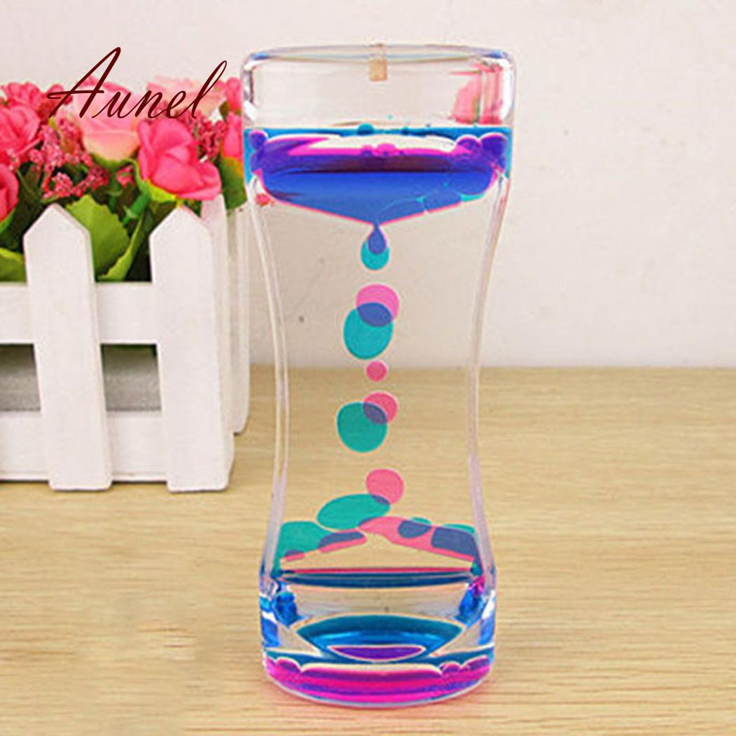 

Подвійні кольори, олія, пісочний годинник, рідина, плаваючий рух, бульбашки, таймер, декор столу фіолетовий