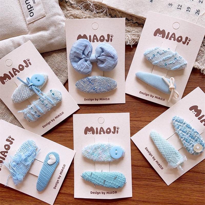 

Blue Floral Fabric Embroidered Cross Girl s Hair Clips
