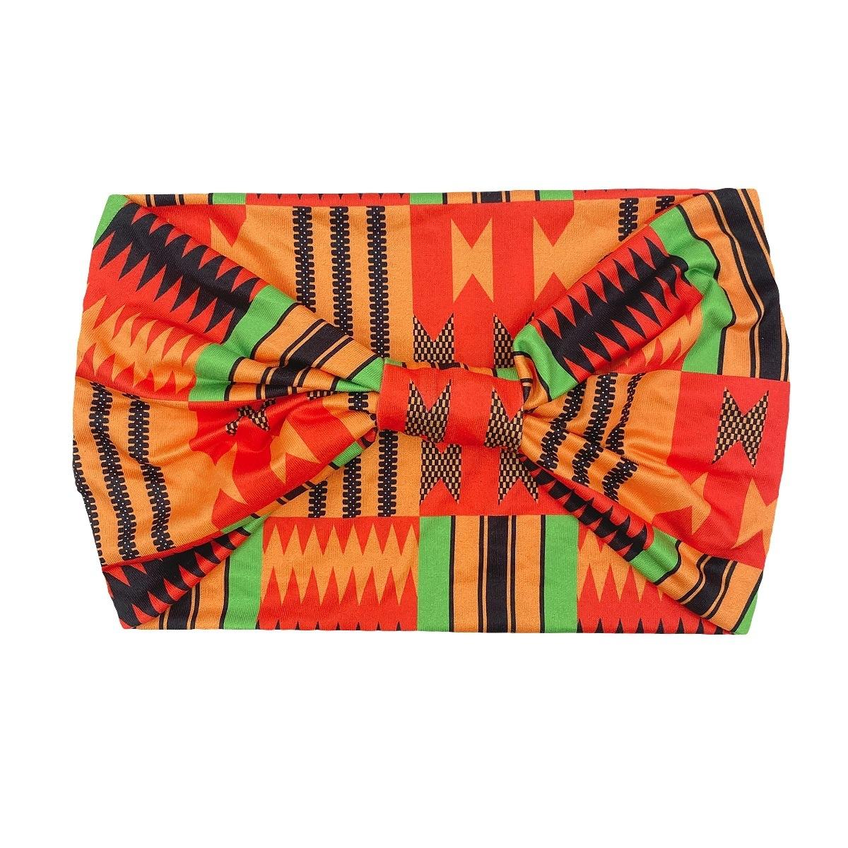 

Спортивна пов’язка на голову з кольоровим візерунком із вузликом. Широка еластична пов’язка на голову