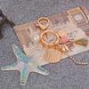 Llavero con colgante de borla y concha de estrella de mar para mujer, llavero bonito