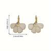 A pair of elegant French-style floral drop earrings, featuring a delicate four-petal flower design, perfect for everyday wear, parties, and vacations.