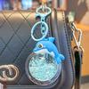 2025 New Oil Flowing Sand Dolphin Keychain: Cute Marine Animal Backpack Pendant for Girls