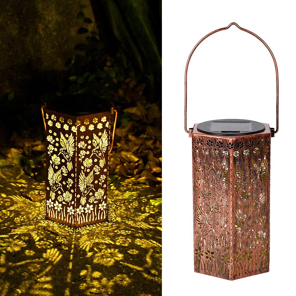 

Уличный солнечный кованый фонарь: Водонепроницаемый полый проекционный настольный светильник для двора и сада