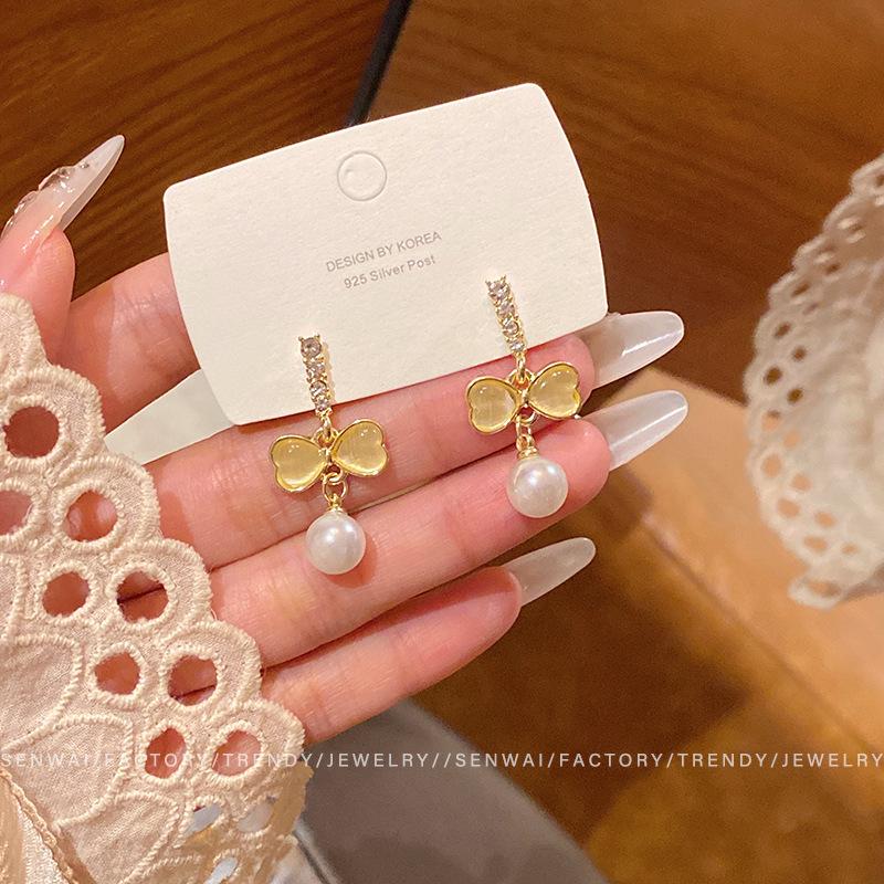 Opal bow earrings women s design sense flash diamond pearl stud earrings retro temperament ear jewelry