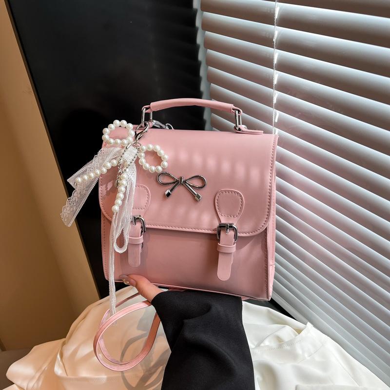 

College style backpack women s 2025 new trendy spring fashion backpack versatile sweet schoolbag portable small square bag single bag рожевий