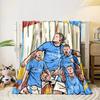 Group of athletes in blue jerseys with bold text and vibrant backdrop. for all seasons blanket lunch break throw gift