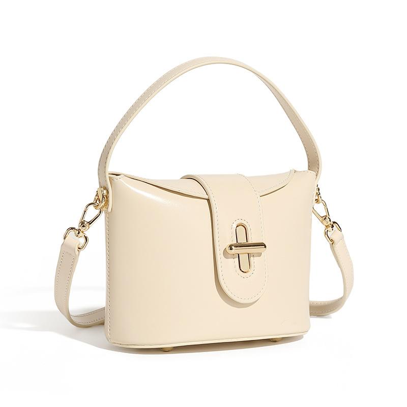 

Новая трендовая городская простая женская сумка из натуральной кожи, сумка через плечо, женская сумка, легкая роскошная нишевая сумка высокого класса с капсульным замком 17*9*14