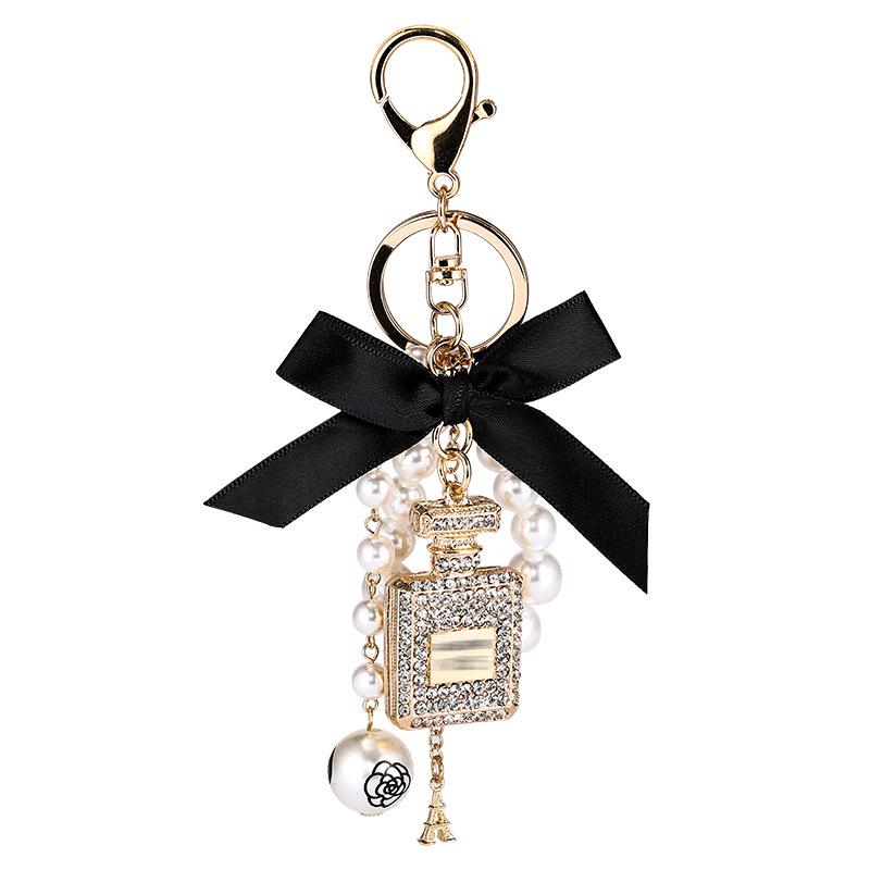 Korean-Style Handmade Rhinestone Perfume Bottle Keychain with Bow and Pearl Charm
