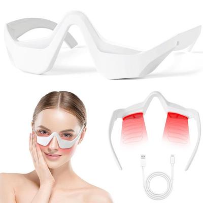 Multifunctional Eye Care Device: Handheld Beauty Massager with Red Light and Essence Application for Home Use.