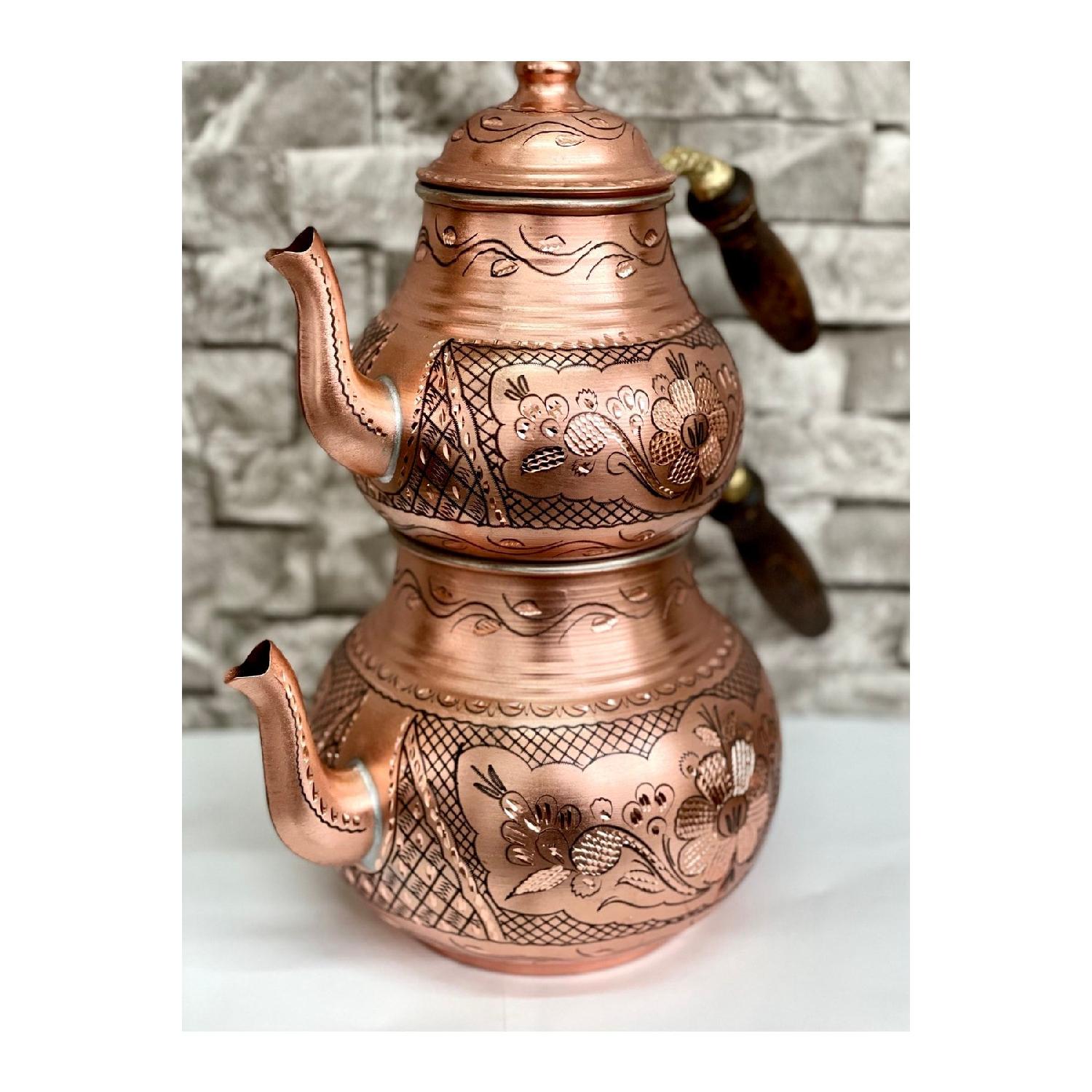 

Медный чайник с вышивкой