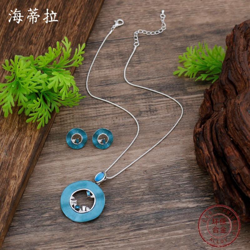 New enamel color hollow round stud earrings pendant set women's fashion high sense hollow ring necklace
