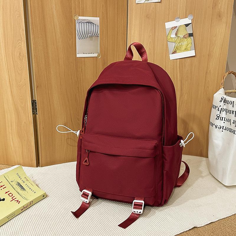 Schoolbag1011 new versatile black schoolbag male college student large capacity backpack female junior high school girl solid color backpack