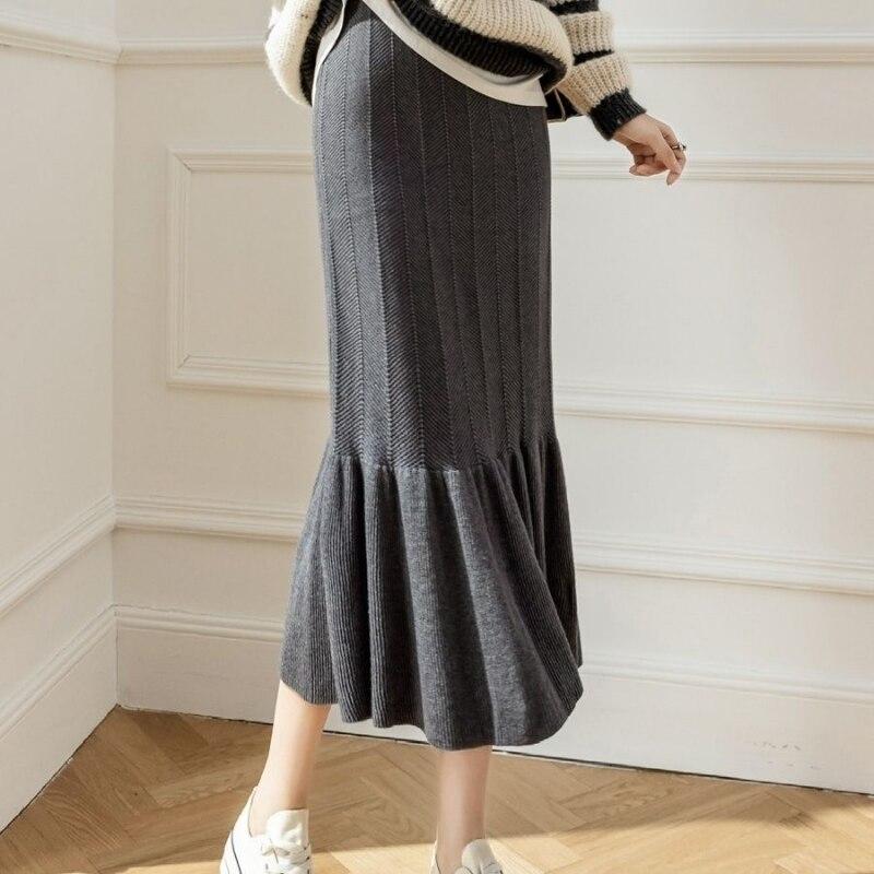 

Трикотажная юбка дизайн чувство рыбий хвост юбка осень и зима 2022 крест покрытая юбка повседневная капля ощущение бедра обернуть юбка женщина