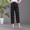 Damskie spodnie codzienne elastyczny pas nadruk w kwiaty luźny krój spodnie z kieszeniami praca