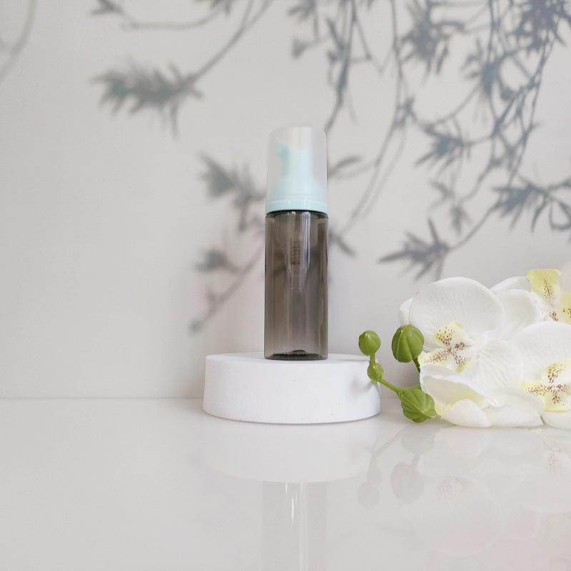 Available 60ml Transparent Black Foam Mousse Bottle for Face Wash and Travel-friendly Cosmetic Packaging.