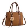 Simple commuting classic flower tassel decorative handbag new gentle temperament crossbody shoulder