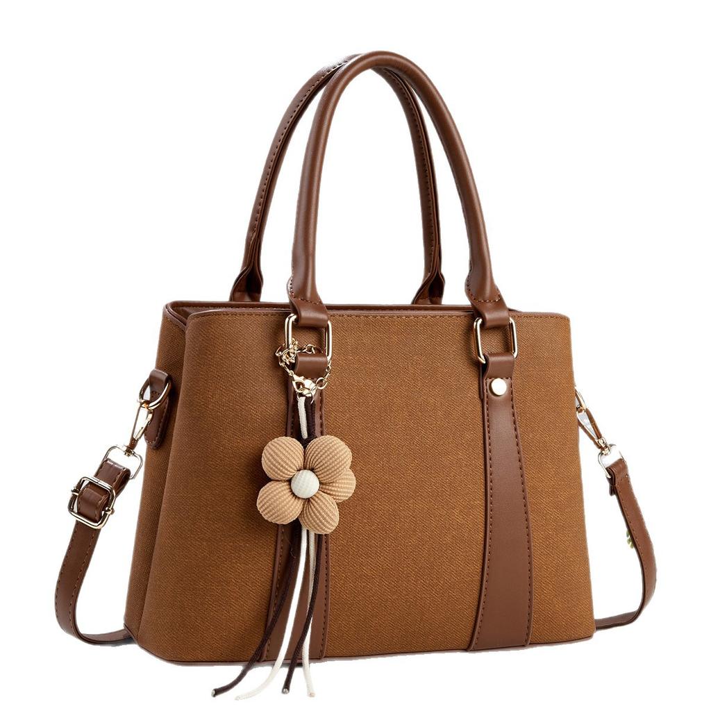 Simple commuting classic flower tassel decorative handbag new gentle temperament crossbody shoulder