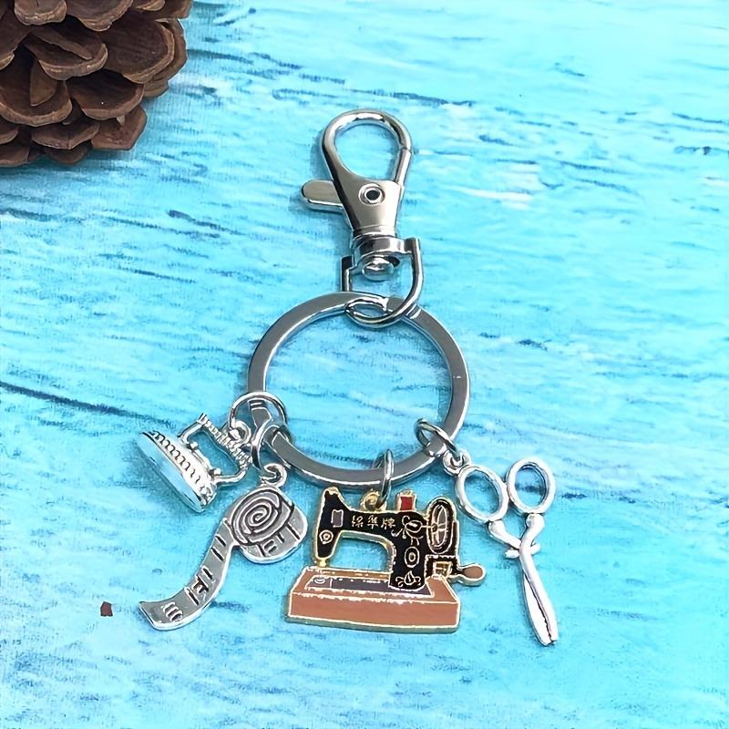 

Fashionable Sewing Machine Keychain with Tape Measure, Iron, and Scissors Charms