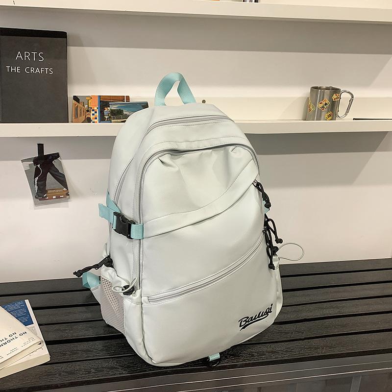 Schoolbag backpack Korean version solid color couple size travel backpack student large capacity anti-splashing light backpack wholesale
