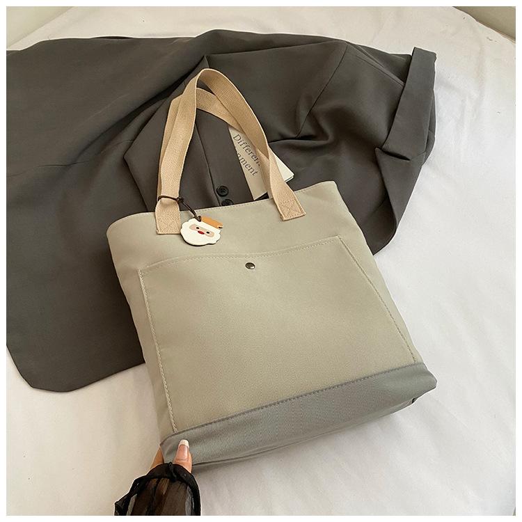 

Japan and South Korea niche design canvas bag women s bag 2025 new fashion casual tote bag commuter large capacity shoulder bag серый