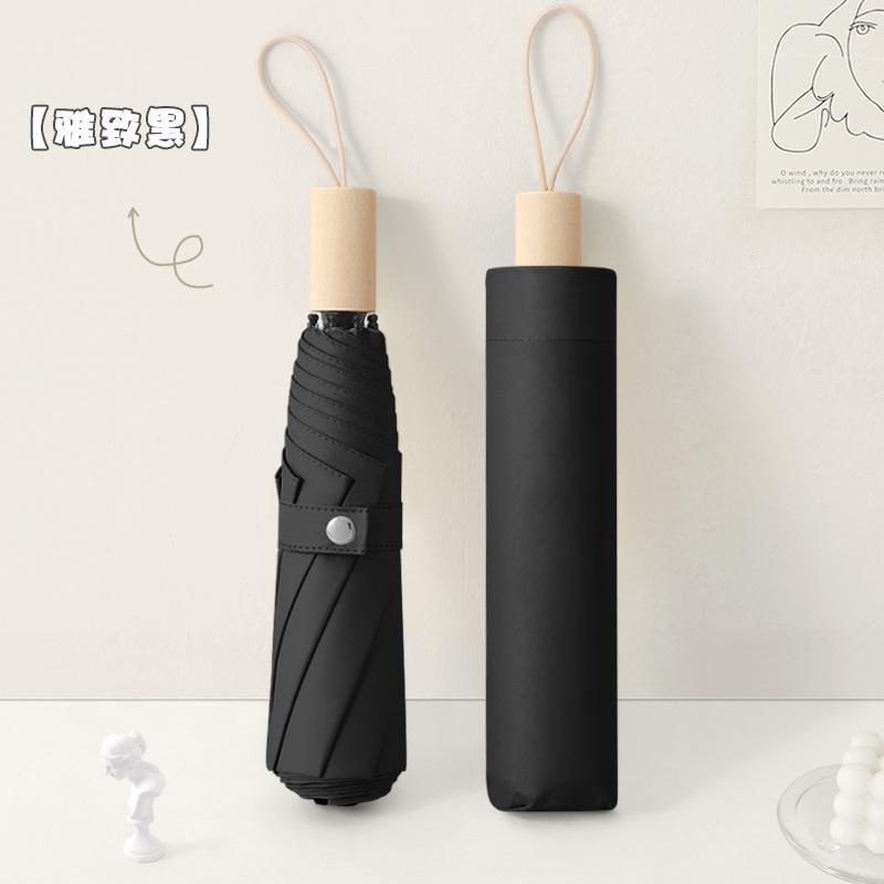 New three-fold simple plain color windproof and sun protection creative solid wood handle female vinyl parasol