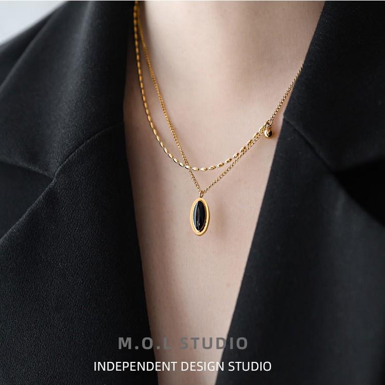 French Retro Two-Layer Black Oval Necklace: Women's Titanium Steel Clavicle Chain, Fade-Resistant Design.