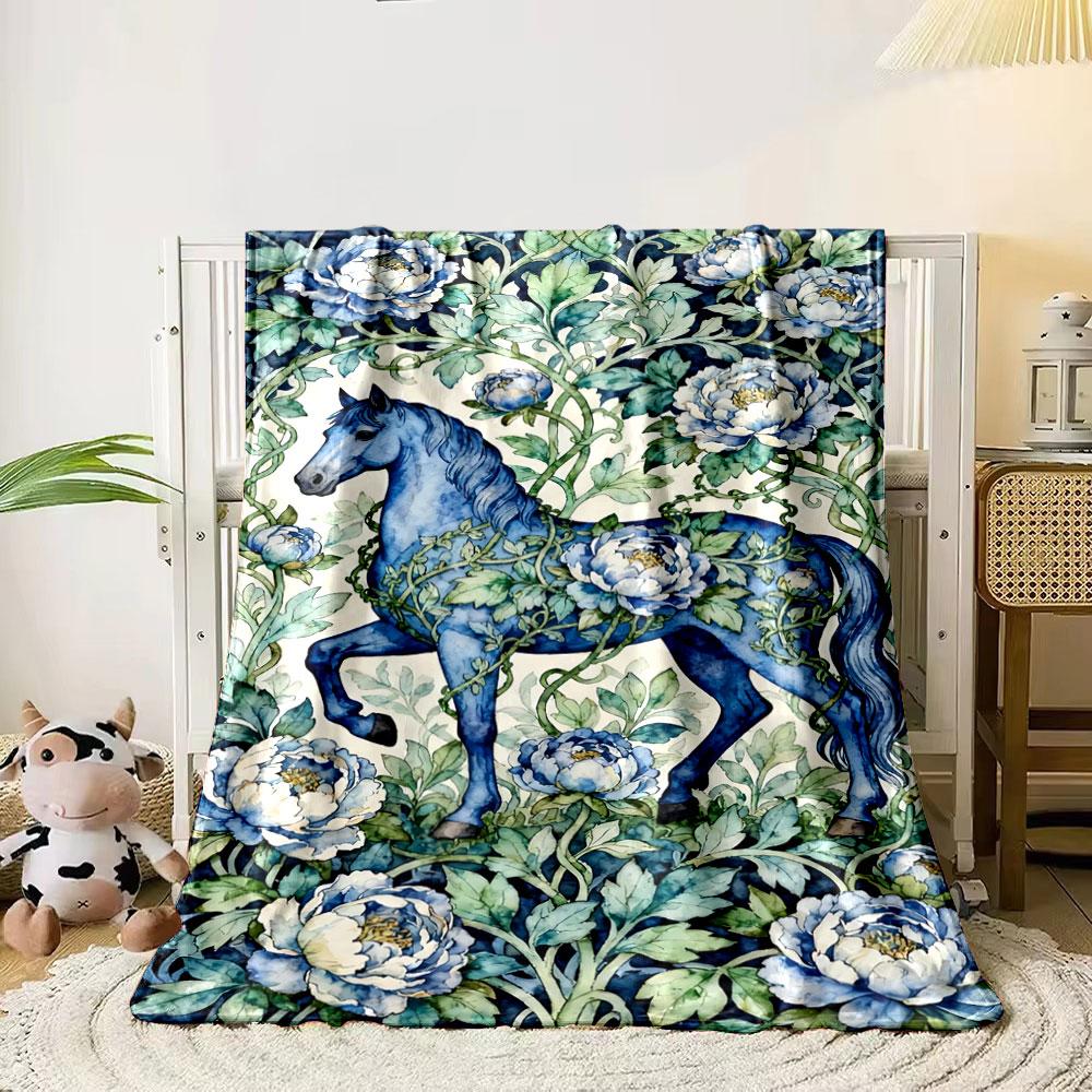 

A blue horse entwined with vines and surrounded by blue peonies. for all seasons blanket lunch break throw gift 80cm x 120cm