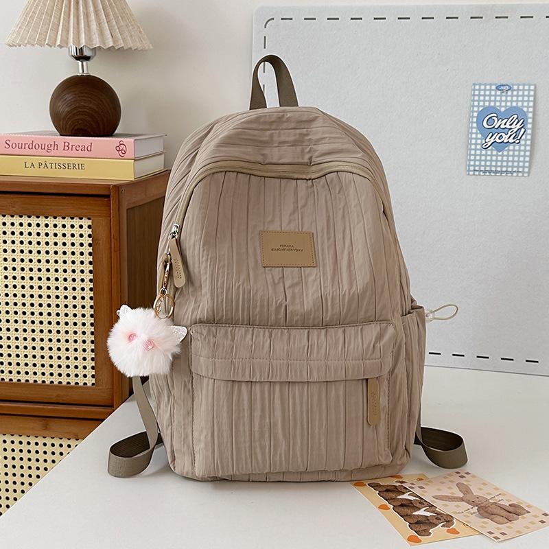 School bag junior high school girls large capacity solid color light primary school backpack high value girl versatile backpack
