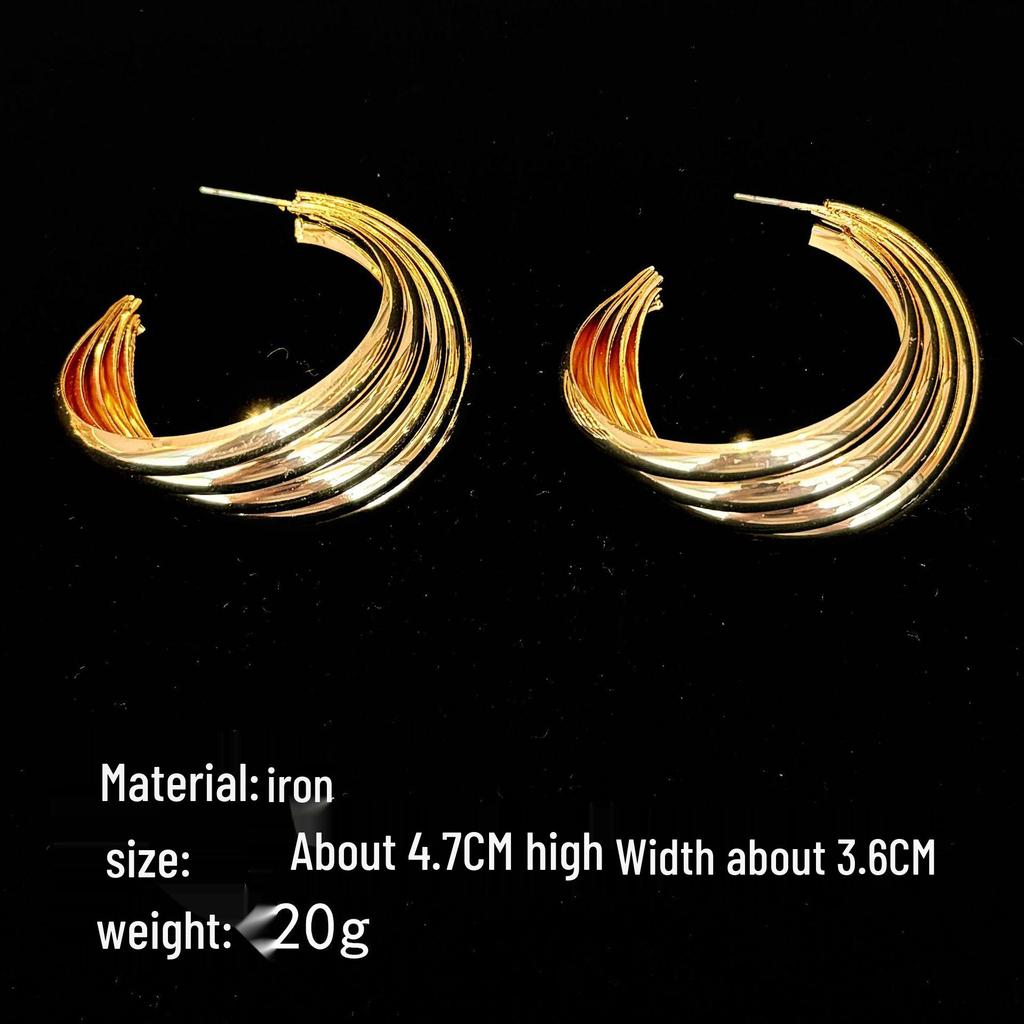 European & American Retro Metal Twisted Hoop Earrings for Women - Bold, Versatile, and Stylish Accessory.