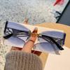 European and American new street photography frameless sunglasses women's hollow metal frames advanced cat glasses sunscreen sunglasses