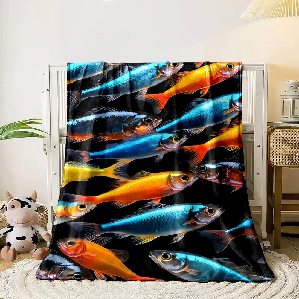 Brightly colored fish in blue and orange tones arranged on a black background. for all seasons blanket lunch break throw gift 80cm x 120cm