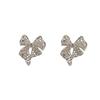 Chic Metal Hollow Bow Earrings: Unique European & American Cool Style