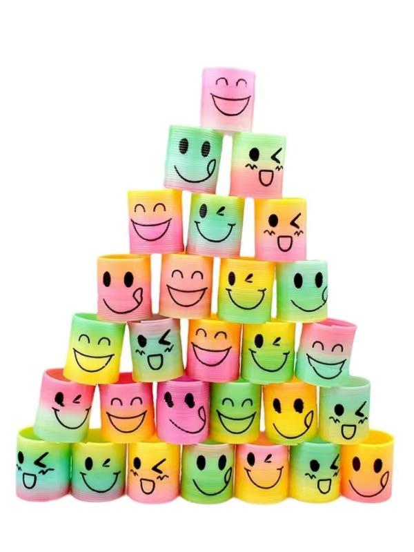 Bunte Plastik-Spiralfeder-Spielzeuge-Happy Face Regenbogen-Designs, für Geburtstags-Partygeschenke, Halloween- und Weihnachtsgeschenke, Karnevalspreise