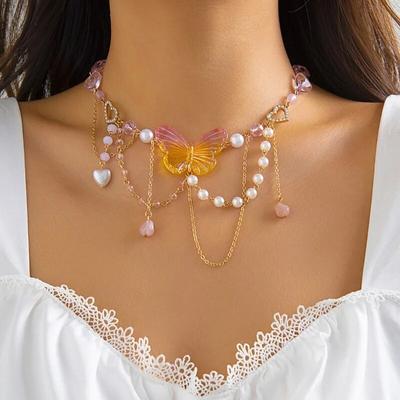 Collar de mariposa con corazón acrílico para mujeres y niñas, estilo Y2K, estilo años 2000, con cadena de perlas de imitación y borlas.