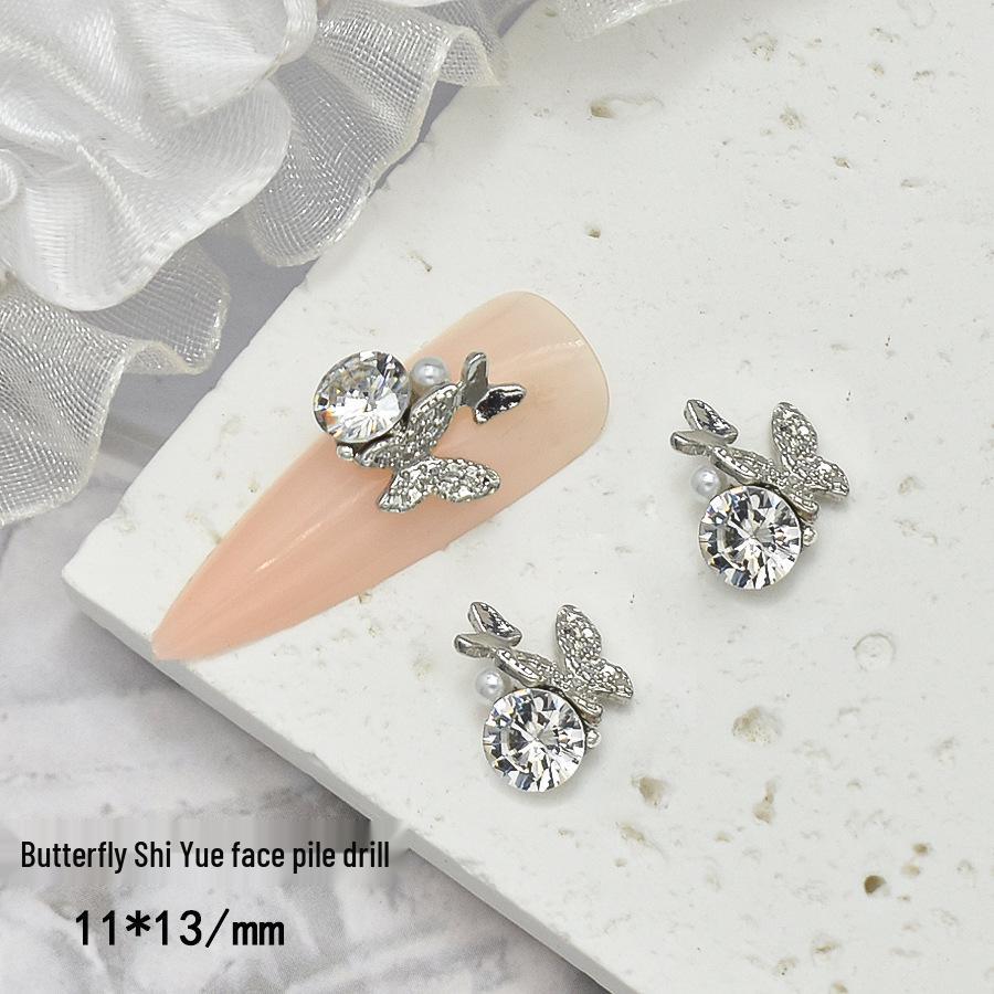 Elegant Nail Art: Pearl & Butterfly Inlaid Pigeon Egg with Zirconia and Rhinestones