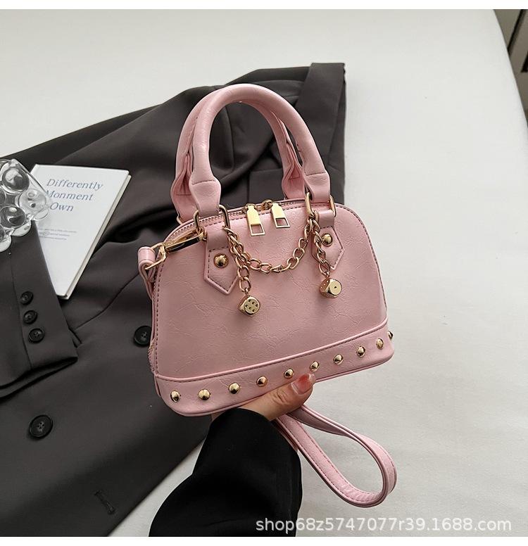 2025 new niche design high-end champagne rivet portable shell bag women's fashionable foreign style shoulder messenger bag