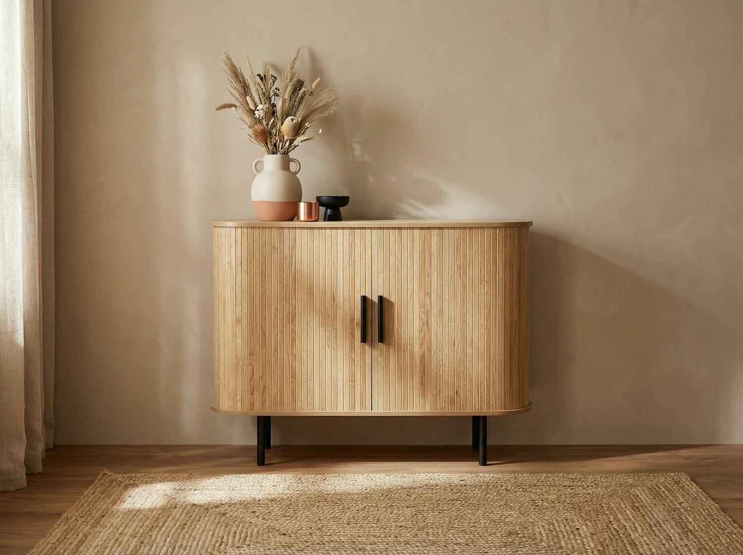 Oval chest of drawers with fluted