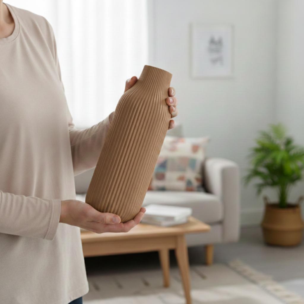 A modern vase with simple lines, elegant brown with a delicate pattern