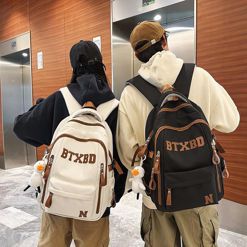 Large-capacity multi-layer schoolbag, junior high school students, girls, boys, high school students, load reduction ridge protection