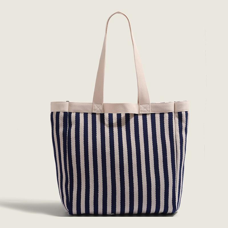 

Striped Canvas Bag Women Large Capacity 2025 Niche New Casual Commuting Tote One-shoulder Mommy синій