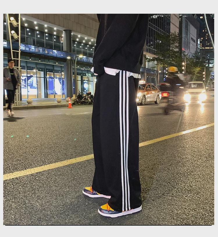 Damskie spodnie sportowe w paski w stylu koreańskim - luźne, sięgające do ziemi, w jednolitym kolorze, na wiosnę i jesień