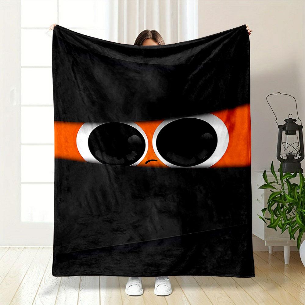 Large eyes with a sad expression peek through black horizontal slits. for all seasons blanket lunch break throw gift