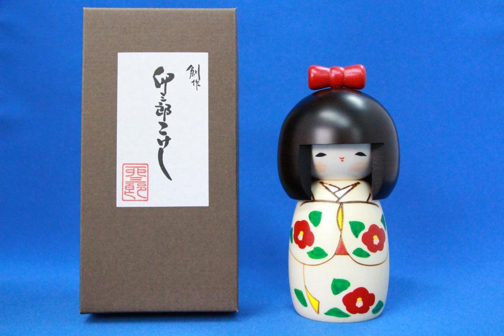 Popular as a souvenir from Japan. [Made in Japan] Folk craft, handcrafted item, Kokeshi doll with ribbon, made by Usaburo.