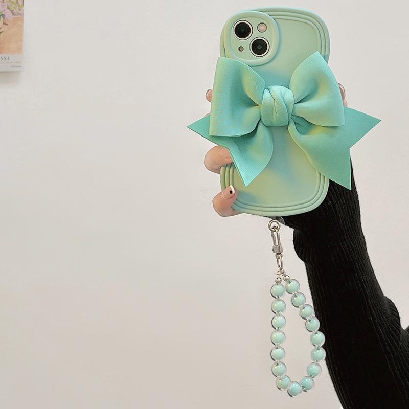 Japanese and Korean wind light green bow is suitable for Apple 17 mobile phone case iPhone16Pro Max wave soft case 14/15.