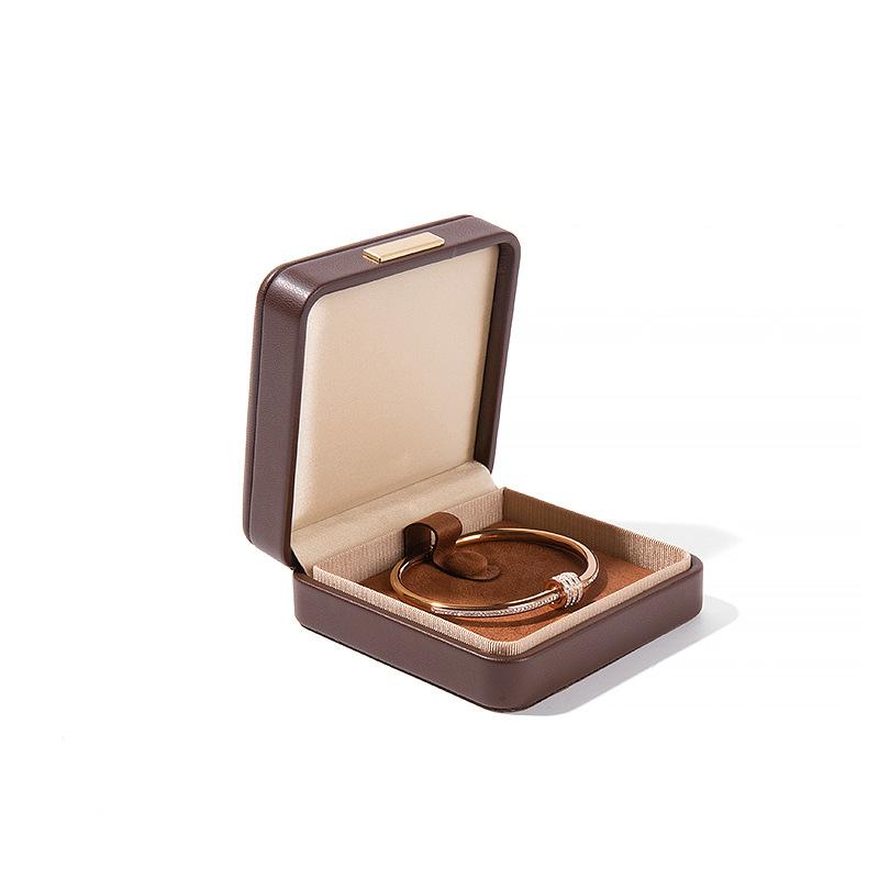 Högkvalitativ PU-läder Rundade Hörn Gyllene Spänne Smyckeskrin Ring Hänge Halsband Armband Förpackning Display Förvaringslåda