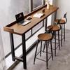 Solid Wood Balcony Bar Table with High-Low Legs and Wall-Leaning Design, Perfect for Window-Side Use, with High Table and Chairs.