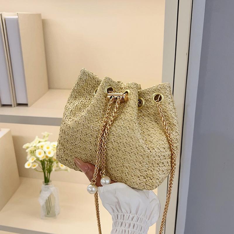 

Summer Weaving Foreign Style 2025 New Fashion Drawstring Large Capacity Trend Chain Crossbody Beach Bucket Underarm Bag хакі